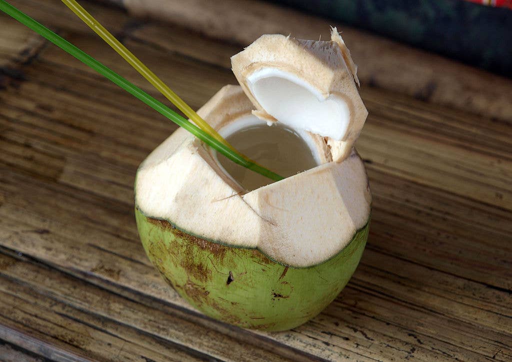 Young coconut opened up for drinking coconut milk