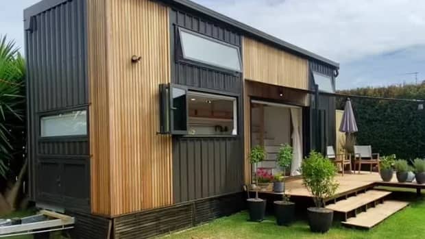 tiny house that has wooden and metal siding