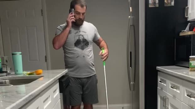 HUSBAND mops house while on the phone