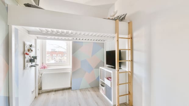 Stylish children's room with pastel-colored walls, bunk bed, TV and toys