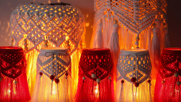 Macrame hand woven with cord red and white lanterns glowing