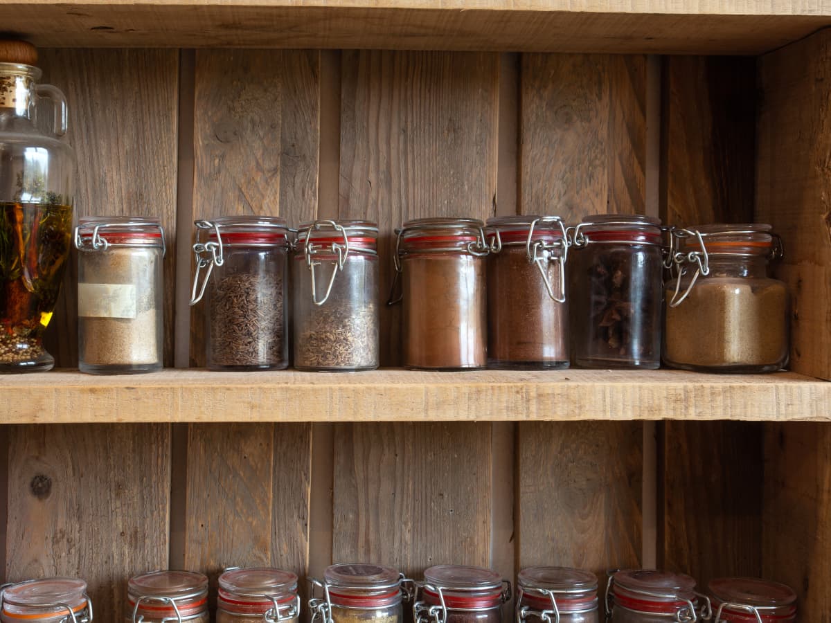 Hidden hinged spice rack