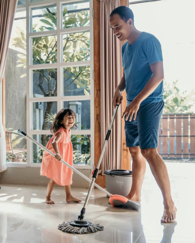 Father and daughter doing chores