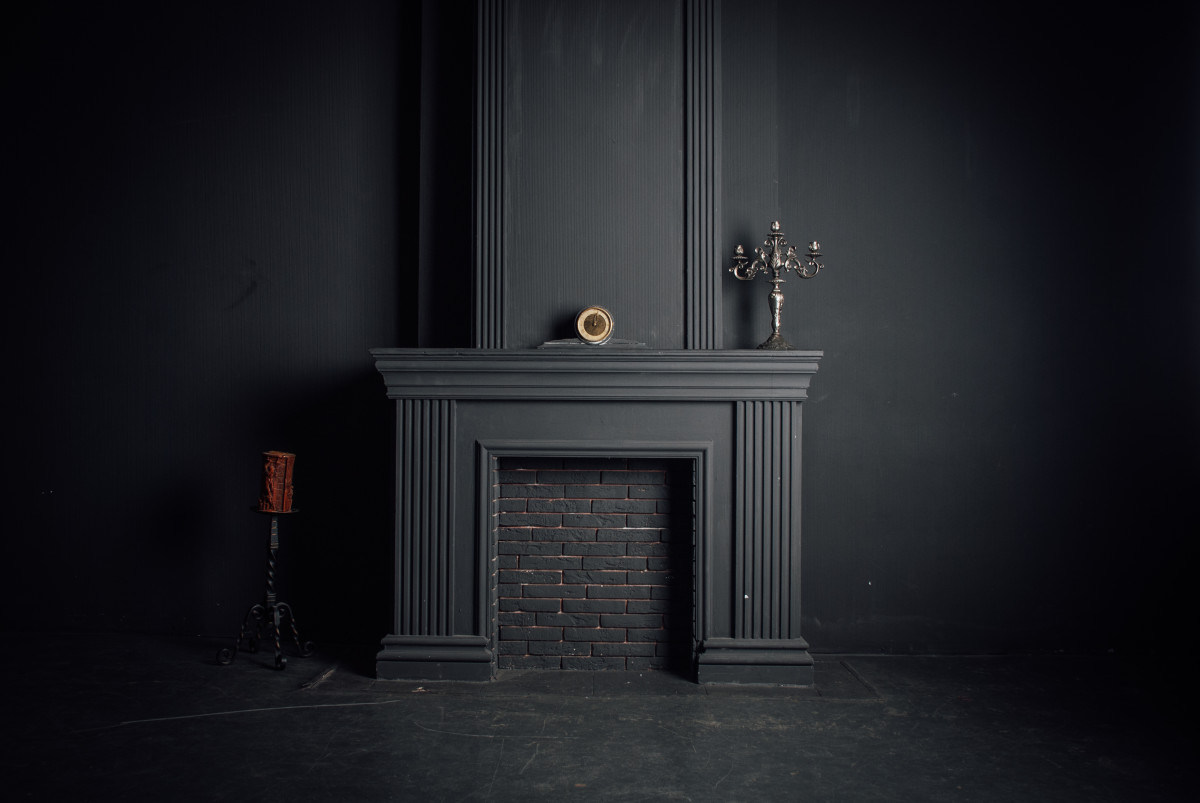 Woman Transforms Her Brick Fireplace With Black Paint and Black