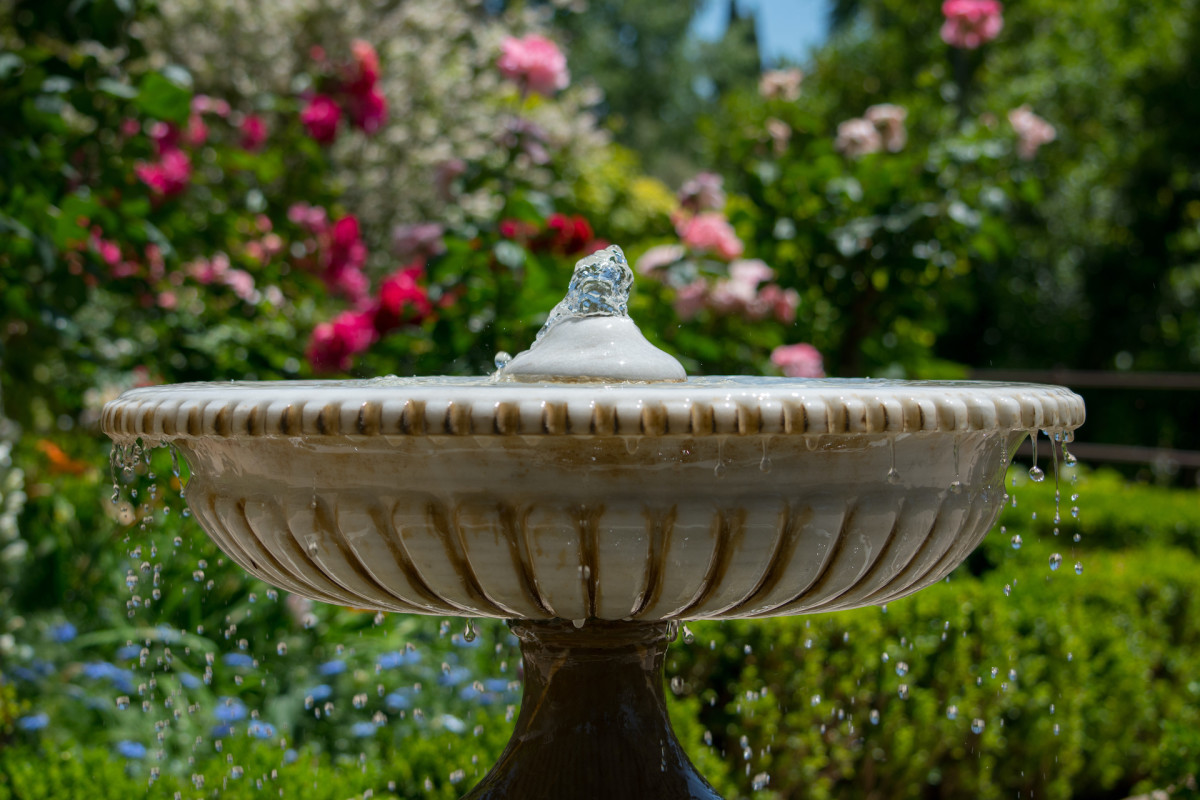 Woman Uses Walmart's Viral Planters to Create Cute DIY Water Fountain ...