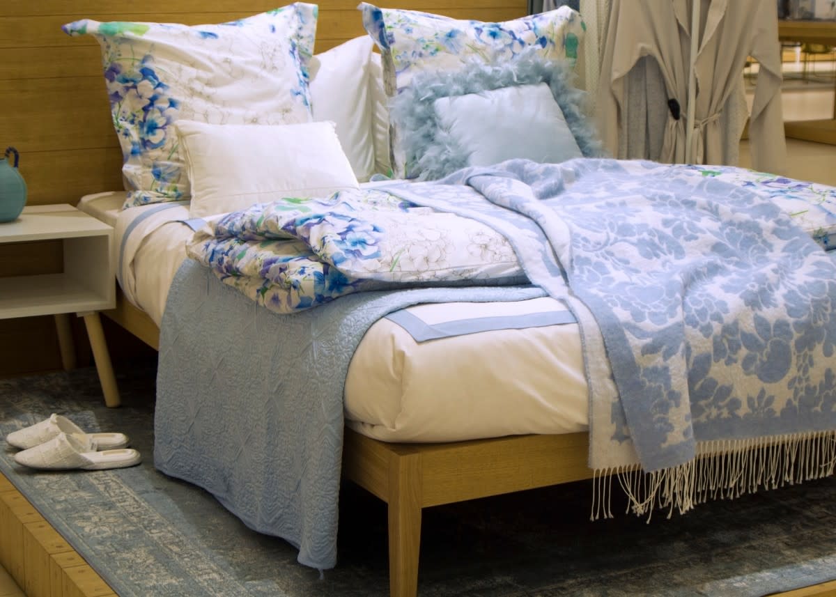 Folding Hack Turns Blankets Into Pillows For Seriously Easy Storage