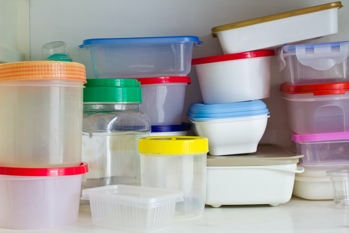 Woman Concocts Brilliant Plastic Container Lid Storage Hack Out of