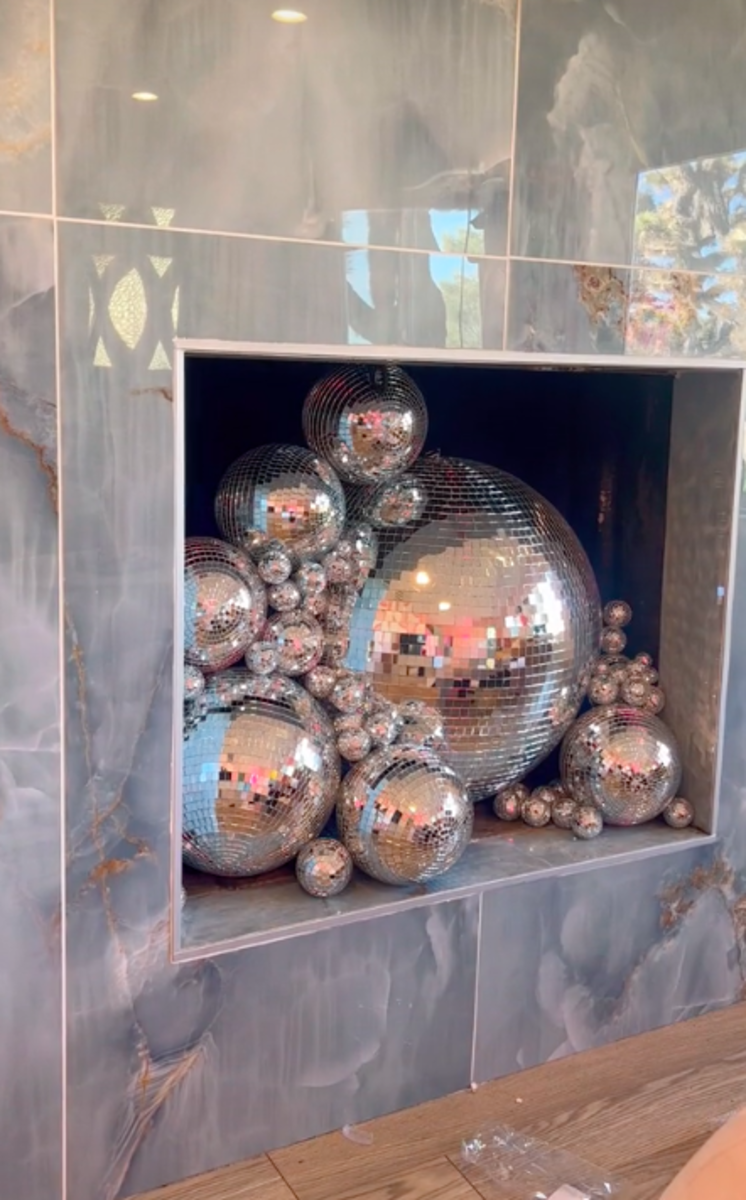 Interior Design Couple Gives Fireplace a Disco Ball Makeover
