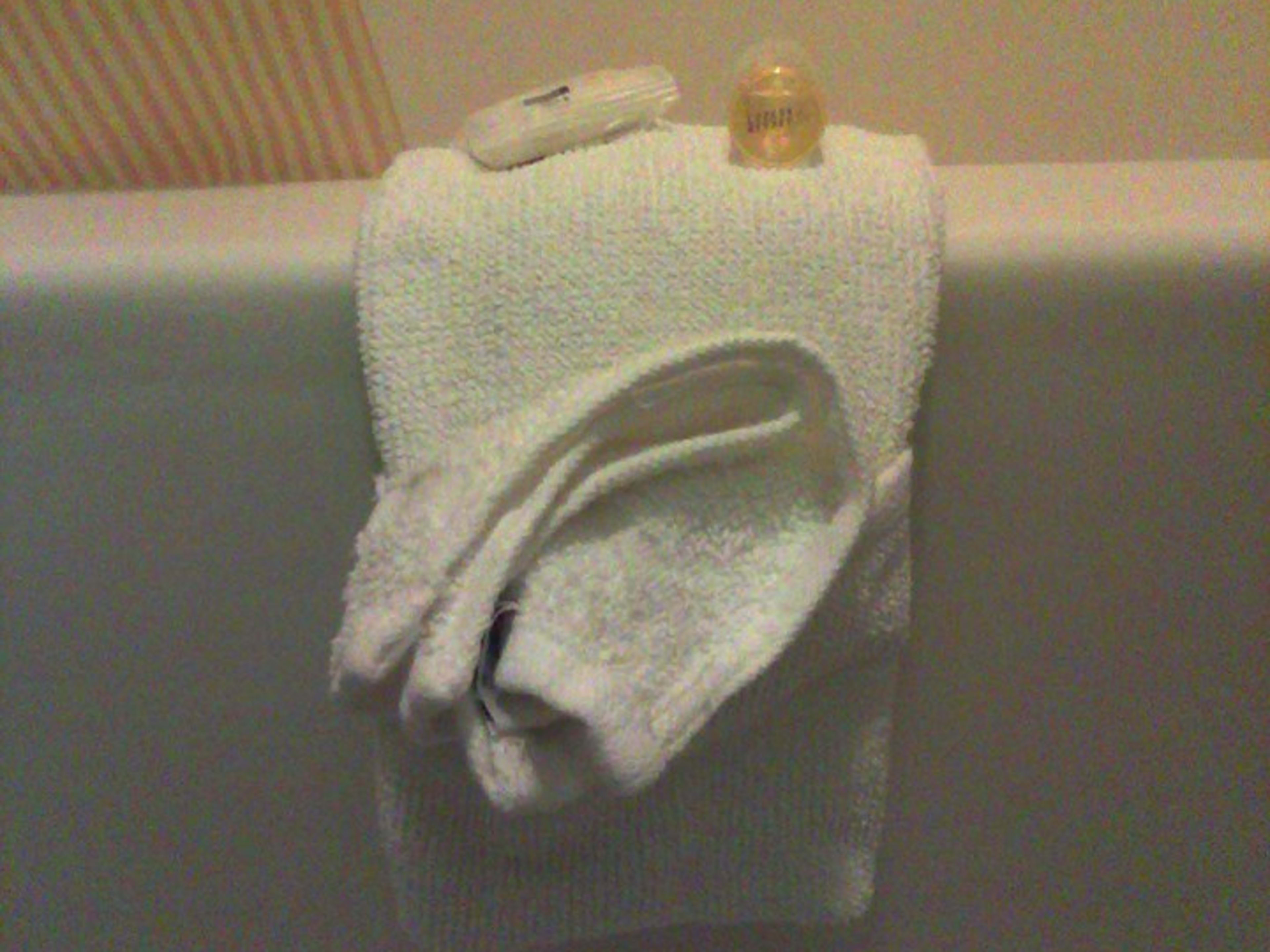 Looks great nicely swept over the side of the tub, but equally beautiful hanging from a towel bar. 